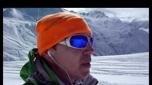 Going up the drag-lift, sunny weather and good snow are ideal for skiing  hd